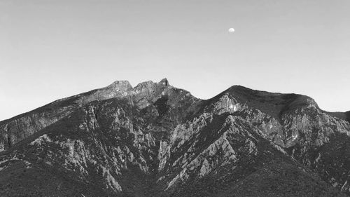 Low angle view of snowcapped mountain against sky