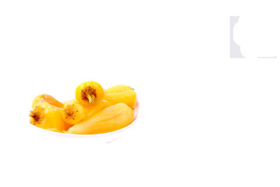 Close-up of yellow flower against white background