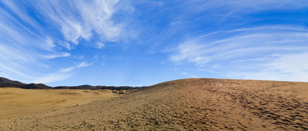 Scenic view of desert against sky