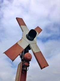Low angle view of traffic sign against sky
