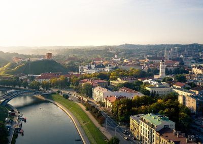High angle view of buildings and trees against sky