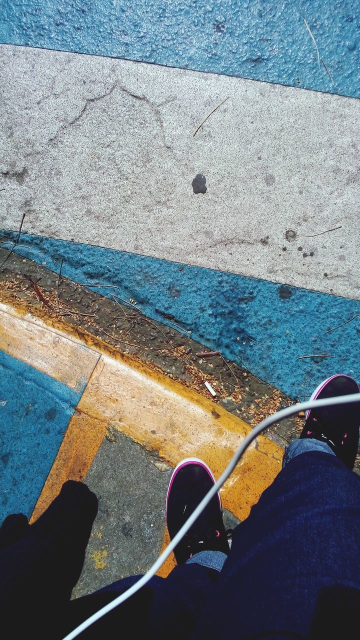 transportation, mode of transport, land vehicle, low section, part of, high angle view, road marking, road, blue, street, person, cropped, personal perspective, one person, day, car, shoe, travel, outdoors, asphalt