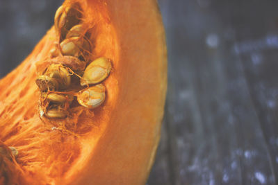 Close-up of orange fruit on wood