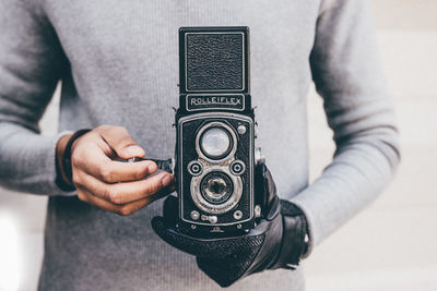 Close-up of man photographing