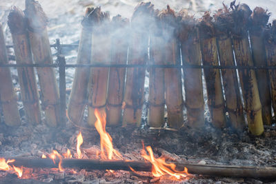 Panoramic shot of bonfire on barbecue grill