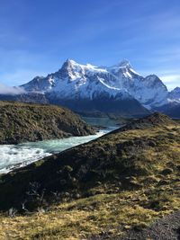 Scenic view of snowcapped mountains against sky