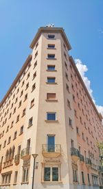 Low angle view of building against clear blue sky