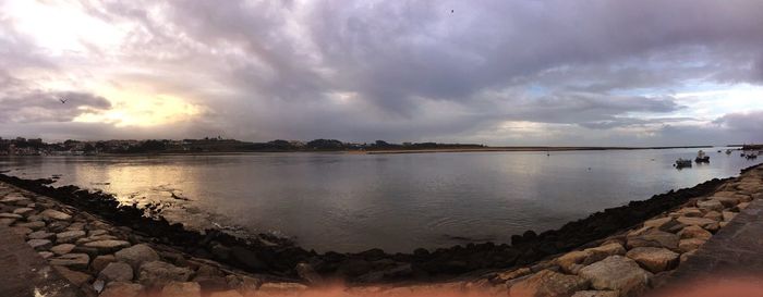 Scenic view of sea against cloudy sky