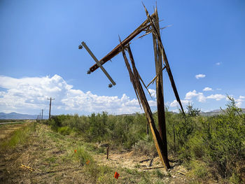 Windmill on field against sky