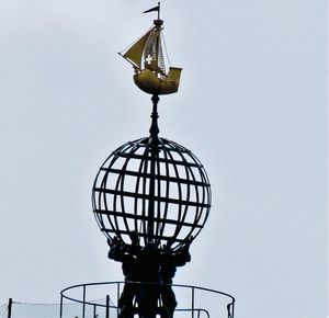 Low angle view of electric lamp against clear sky