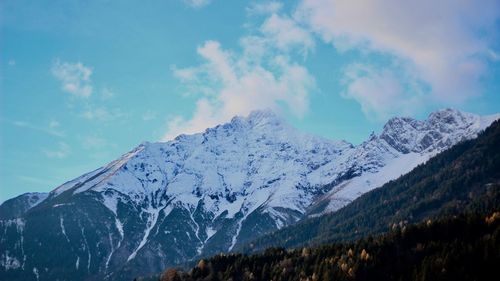 Scenic view of snowcapped mountains against sky
