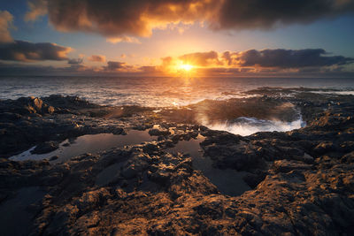 Scenic view of sea against sky during sunset