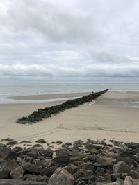 Scenic view of beach against sky