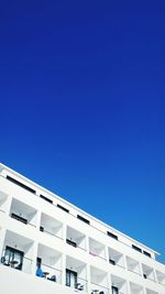 Low angle view of building against clear blue sky