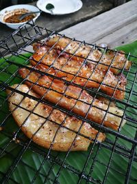 High angle view of meat on barbecue grill