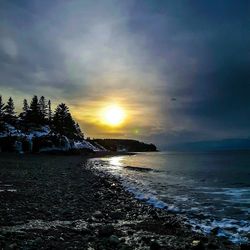 Scenic view of sea against sky during sunset
