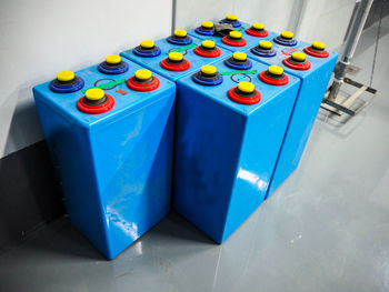 High angle view of batteries on tiled floor