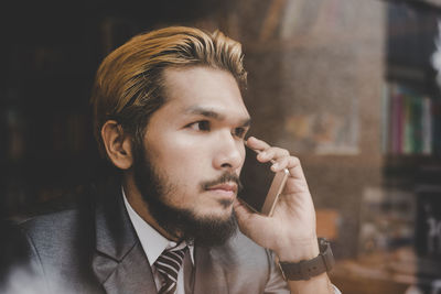 Close-up of businessman talking on phone