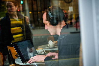 Portrait of woman working with laptop