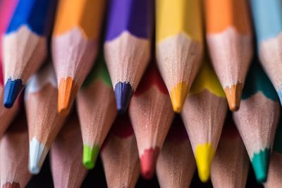 Close-up of colored pencils on table