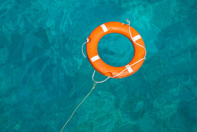 High angle view of life belt on swimming pool