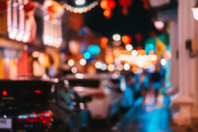 Defocused image of illuminated city at night