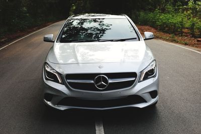 Close-up of car on road