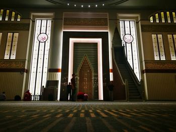 People in corridor of temple