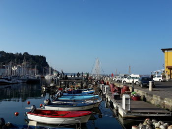 Boats moored at harbor