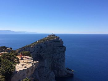 Scenic view of sea against blue sky