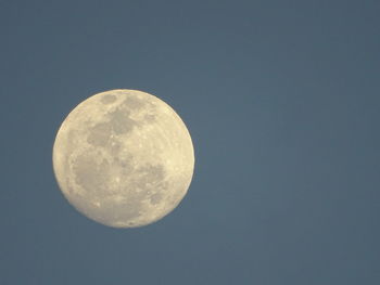 Low angle view of moon against clear sky at night