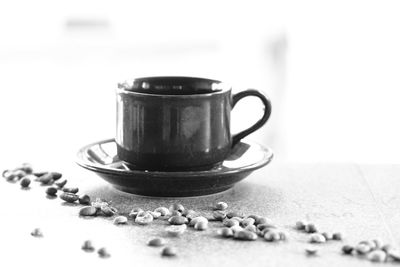 Close-up of coffee cup on table