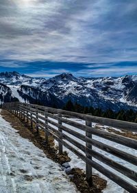 Scenic view of snowcapped mountains against sky during winter