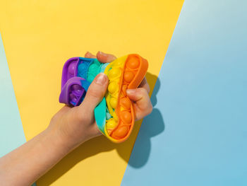 Close-up of hand holding toy