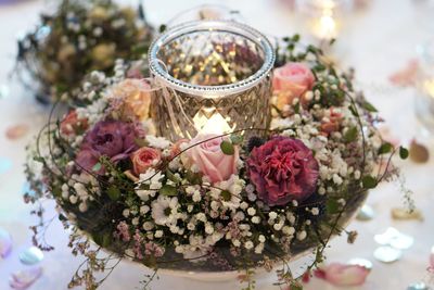 Close-up of pink flowering plant on table