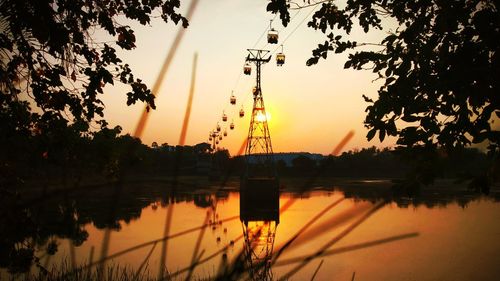 Scenic view of lake against orange sky