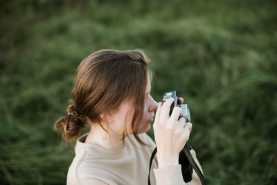 Portrait of woman photographing