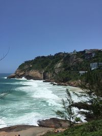 Scenic view of sea against clear blue sky