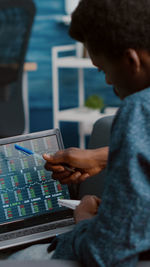 Man using laptop at office