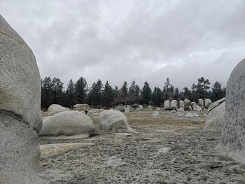 Panoramic view of rocks on field against sky