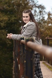 Girl in autumn modelling on bridge with perspective 