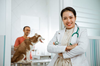 Portrait of doctor with dog