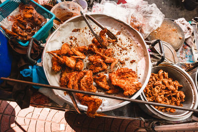 High angle view of fried chicken for sale at market stall