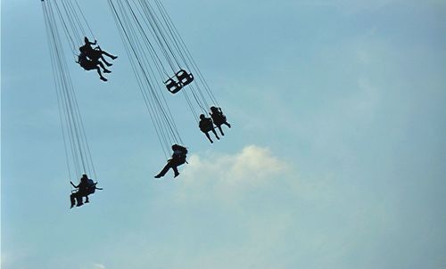 Low angle view of helicopter against sky