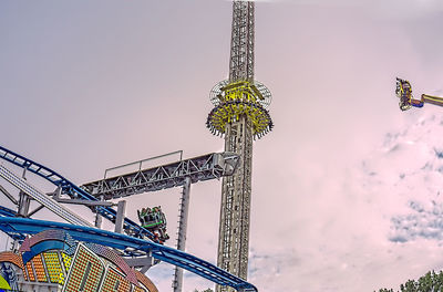 Low angle view of ferris wheel against sky