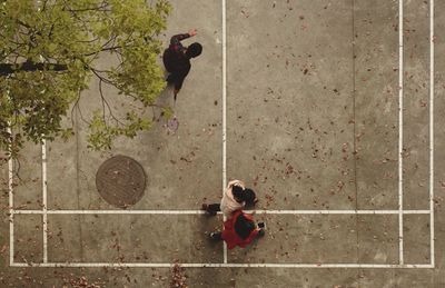 High angle view of children playing at badminton court