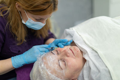 High angle view of woman giving massage