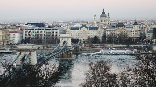 View of bridge over river in city