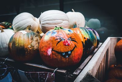 Close-up of anthropomorphic face on pumpkin at market