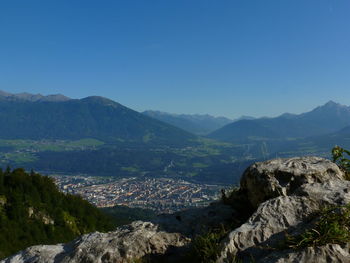 Scenic view of mountains against clear blue sky